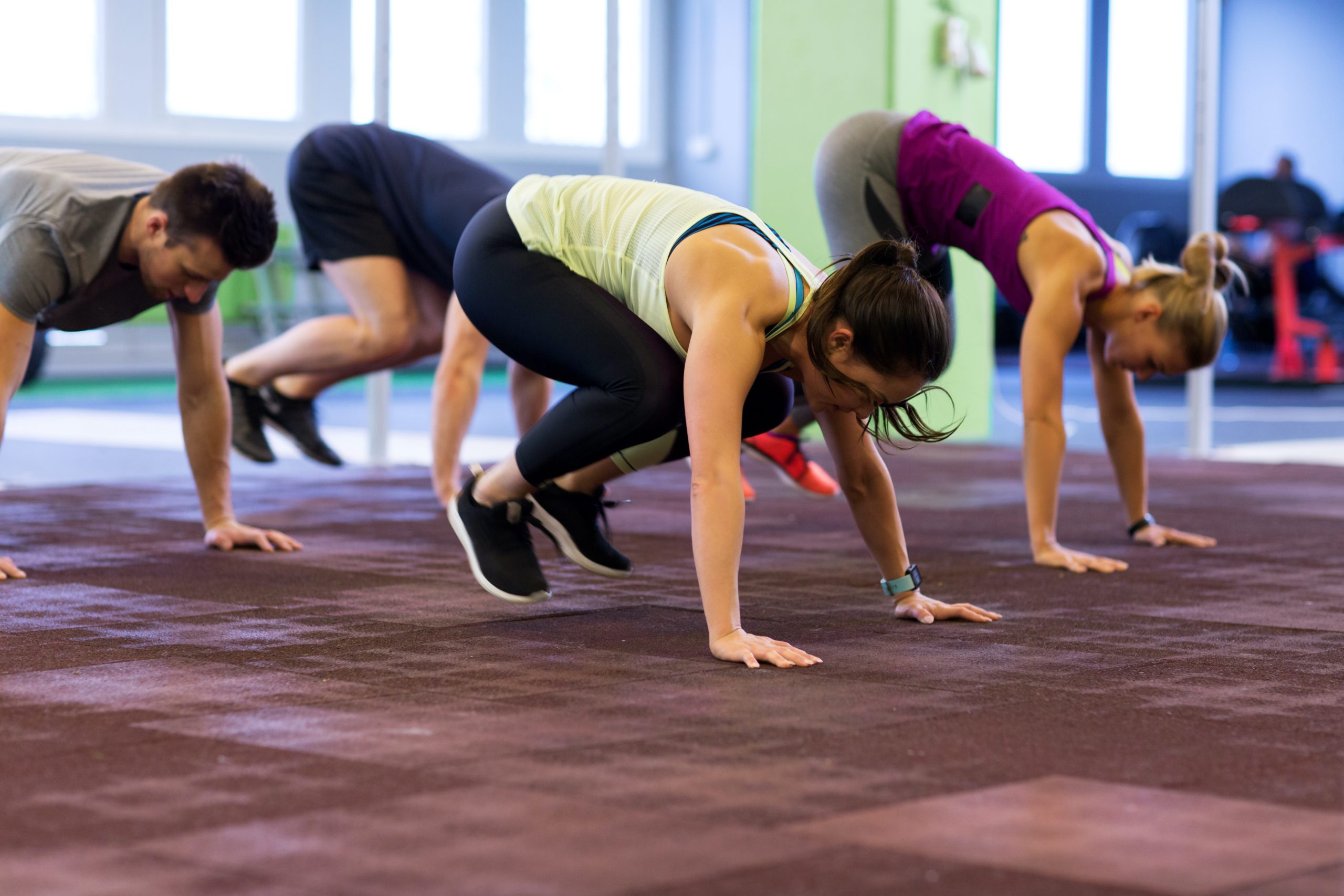 Fitness,,Sport,And,Healthy,Lifestyle,Concept,-,Group,Of,People crossfit burpees